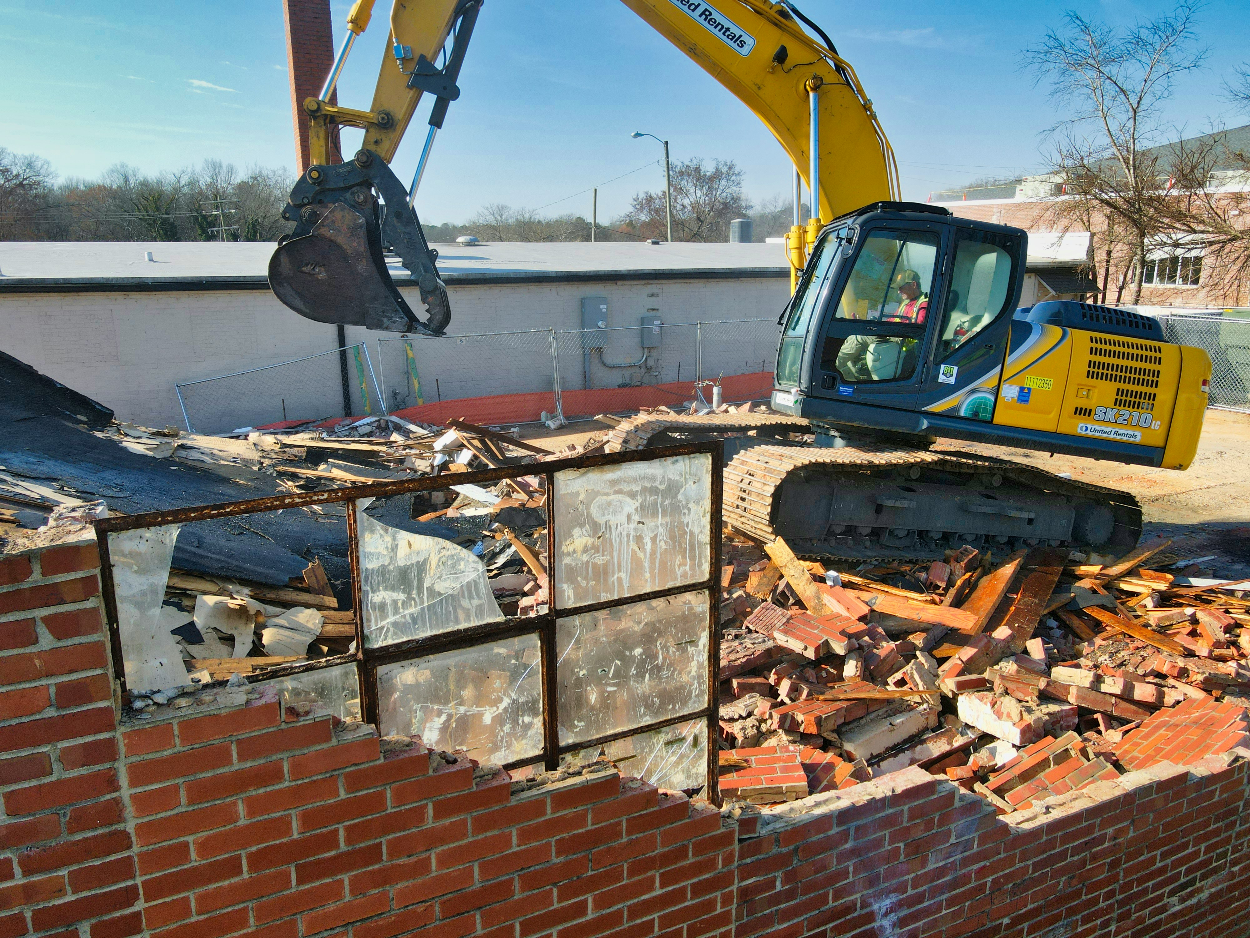 Excavator at demolition site